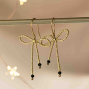 Bow Zwarte Onyx Goudkleurige Oorbellen